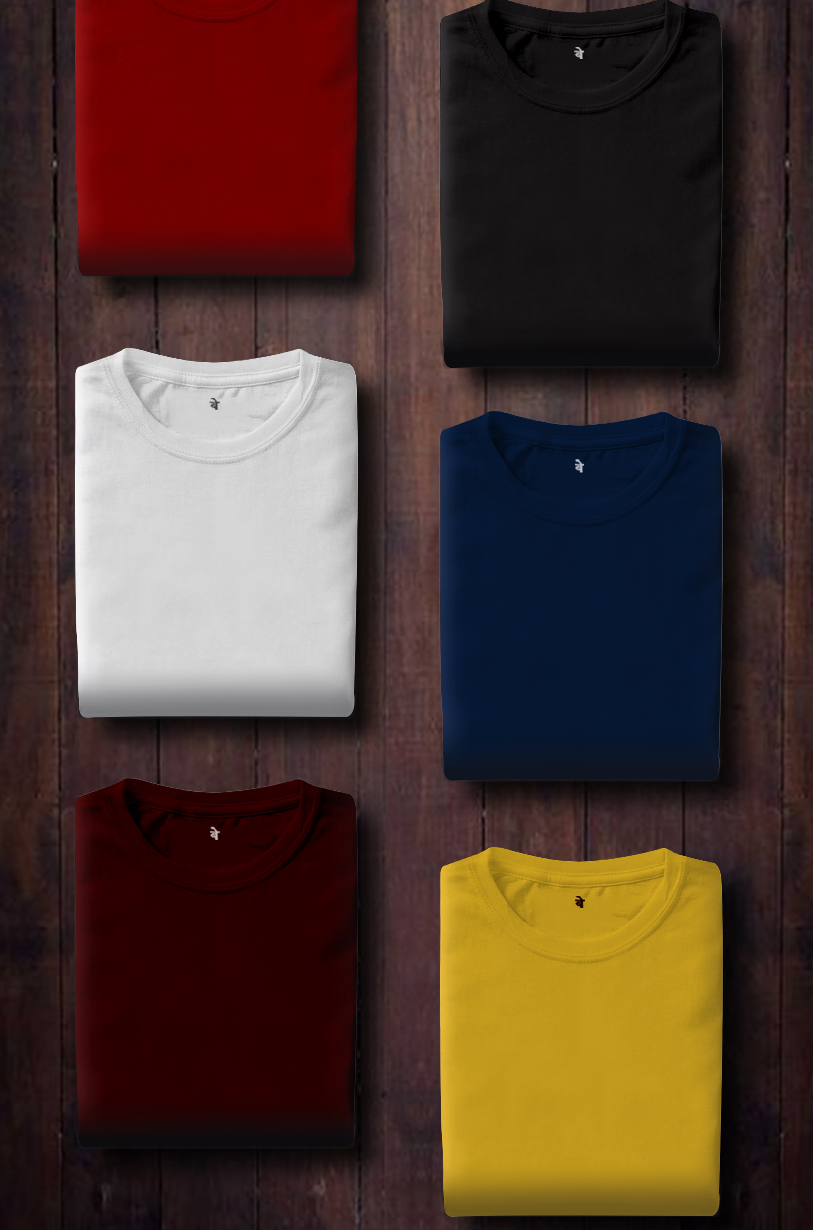 Multiple colored Oasis men's T-shirts rest on a wooden surface.